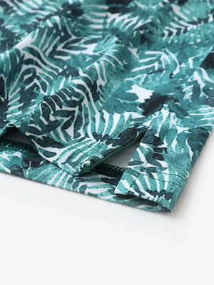 Hem slit detail of MAELREG Performance Jersey Print Polo in Dark Green Leaf – comfort & movement