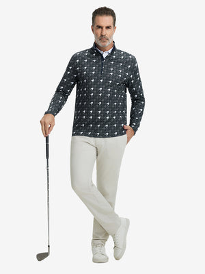 Full-body shot of model holding golf club, dressed in full print quarter zip pullover in grey houndstooth.