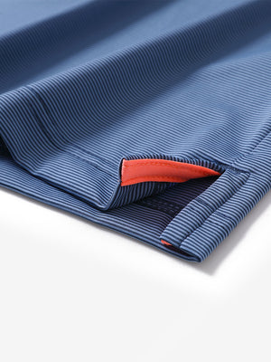 Hem detail of Long sleeve pinstripe jersey polo with neat finish in blue denim stripe