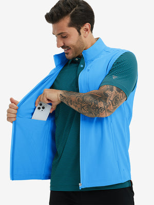 Close-up of water-resistant fleece golf vests pocket holding a phone, practical detail in sky blue