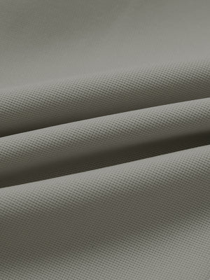 Fabric close-up of lightweight moisture wicking dress pants, showing texture and finish in dark khaki.