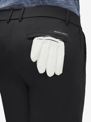 Detail view of back pocket on black flat front golf joggers pants with belt loops