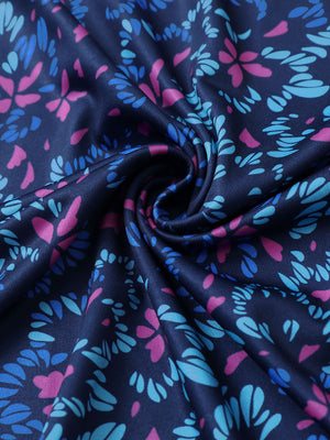 Fabric close-up of Everyday performance print polo with lightweight texture in navy colorful flower