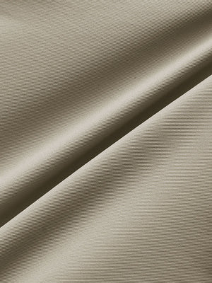 Close-up of khaki water resistant golf shorts fabric texture.