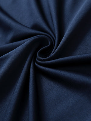 Close-up of navy long sleeve solid jersey polo fabric texture showing soft knit and smooth finish details.