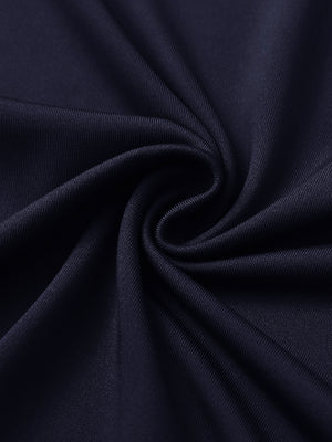 Close-up of navy women's performance solid polo fabric texture.