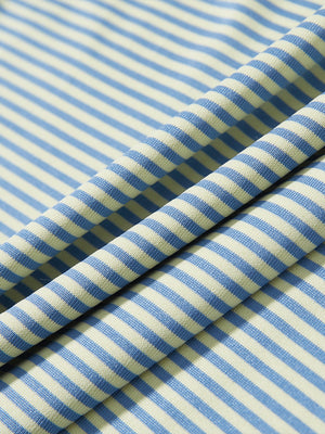 Texture close-up of Kids stripe golf polos with soft fabric and bright yellow stripe stripes