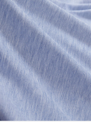 Close-up texture of light blue featherweight midlayer quarter zip pullover fabric showing detailed lightweight material and weave.