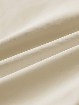 Close-up of fabric on water resistant everyday pants, showing texture and finish in light khaki