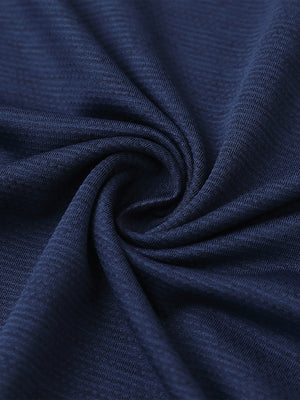 Close-up of dark blue heather ventilated heather jacquard polo fabric showing breathable texture and subtle pattern details.