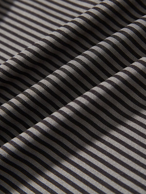 Fabric detail of Performance cooling polo - youth with breathable feel in black stripe