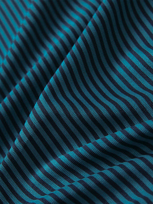 Texture close-up of Kids stripe golf polos with soft fabric and bright turquoise stripe stripes