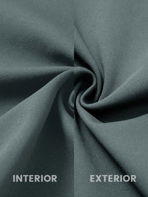 Close-up of fabric on water-resistant zip up golf jacket, showing texture and finish in dark dusty blue.