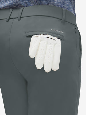 Detail view of back pocket on dark grey flat front golf joggers pants with belt loops