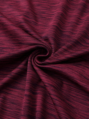 Close-up of burgundy heather cool heather texture polo fabric showing soft surface.