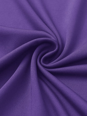 Close-up of purple women's performance solid polo fabric texture.