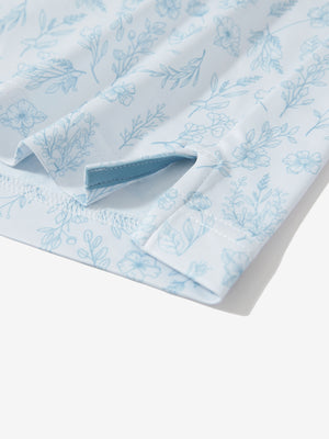 Detail: hem slit of white blue florals stretch printed collarless henley golf shirts