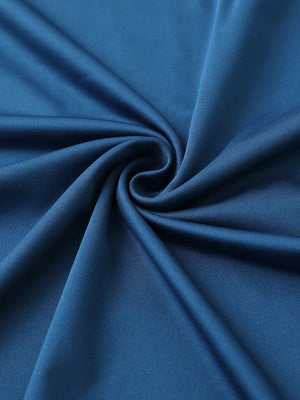 Close-up of cobalt blue1 chest print polo shirt fabric showing smooth texture and crisp graphic application area.