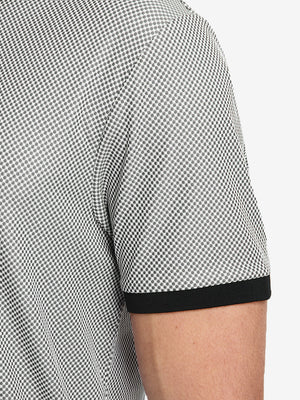 Detail shot of the sleeve cuff on the black quick dry jacquard ribbed collar golf shirt