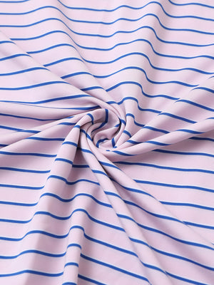 Close-up of light pink/cobalt stripe popular yarn dyed stripe polo fabric showing crisp lines and soft texture.