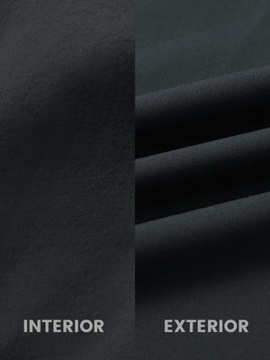 Close-up of inside and outside fabric of water-resistant fleece golf vest in black, highlighting material texture and durability for optimal performance.