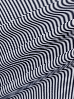 Close-up fabric view of long sleeve pinstripe jersey polo, smooth knit with subtle navy stripe stripes