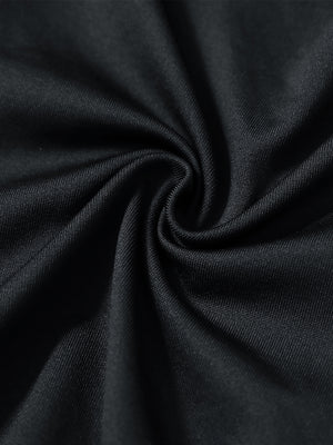 Close-up texture of  black warm puffer winter golf jacket fabric showing detailed premium material and weave