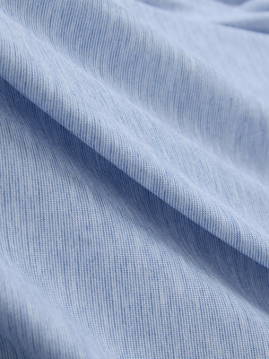 Close-up of light blue ultra-light quick dry moisture wicking collared polo shirt fabric texture