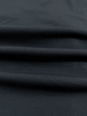 Close-up of lightweight breathable fabric texture, showing fine woven details, lightweight upf50+ short sleeve golf vests jacket in dark grey
