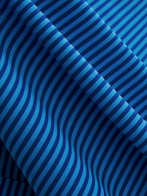 Close-up of cobalt stripe upgraded two-tone striped quick dry polo shirt, showcasing texture and print details.