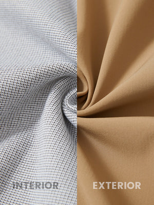 Close-up of fabric on water-resistant heat-tech softshell winter jacket with hood, showing texture in khaki.
