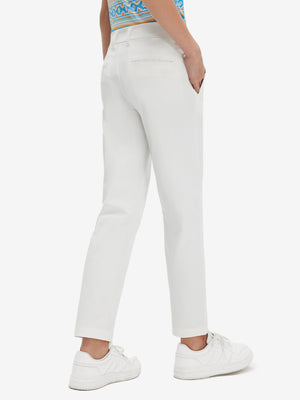 Back lower body view of model wearing the white youth water resistant cotton blend golf pants, highlighting the rear design