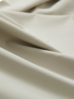 Close-up of the smooth cotton-blend fabric on the oyster gray everyday classic solid polo