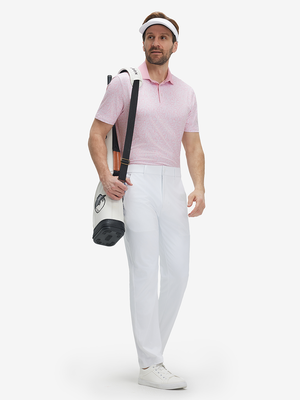Full front: model in pink artichoke lightweight stretch upgraded print golf polo shirts carryinggolf bag.