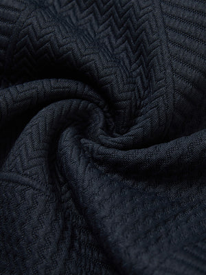 Close-up fabric detail of soft sweatpants with 4 zipper pockets, smooth texture and cozy navy feel