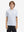 Front half-body shot of youth in white golf performance print boys golf polo, highlighting design and fit