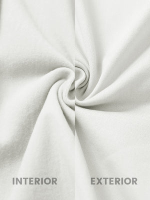 Inside and outer fabric close-up of white lightweight water resistant puffer vest, quilted shell with soft lining.