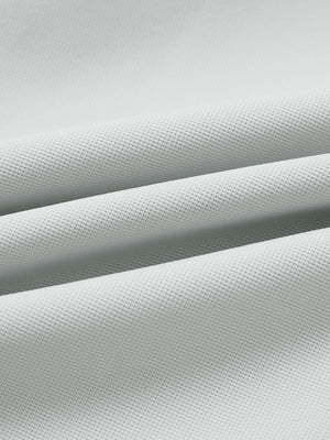 Fabric close-up of lightweight moisture wicking dress pants, showing texture and finish in silver grey.